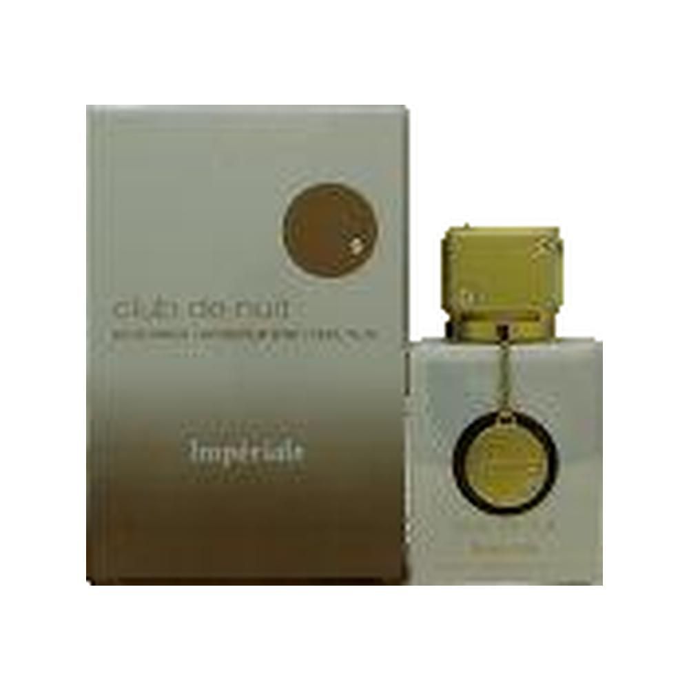 Parfümflakon und Verpackung. Flakon quadratisch, weiß mit goldenem Verschluss. Verpackung rechteckig, beige mit goldenem Kreis.