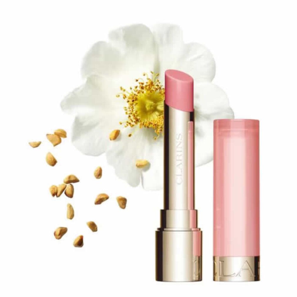 Weiße Rose, Samen und Lippenbalsam. Marke Clarins sichtbar. Geöffnet und geschlossen dargestellt.