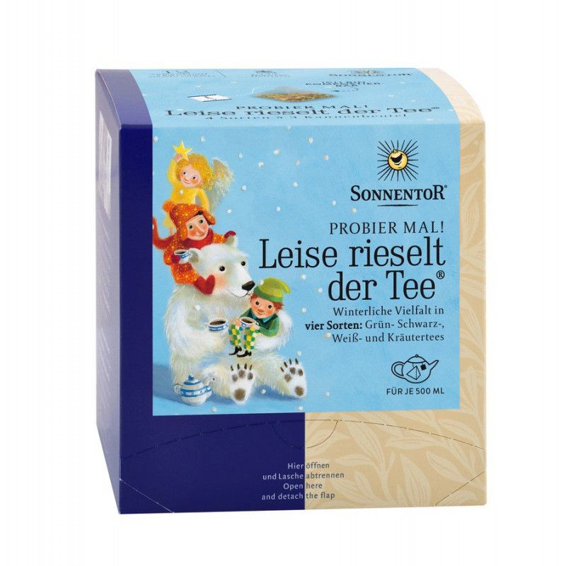 Verpackung von Sonnentor Tee. Blaue und beige Schachtel mit Illustrationen und Text: Leise rieselt der Tee. Winterliche Vielfalt.