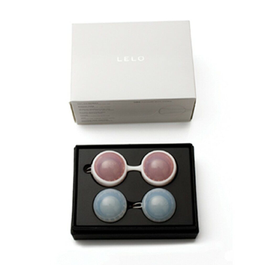 Weiße Box mit schwarzer Box. Zwei rosa und zwei blaue Kugeln. LELO Beads Classic.