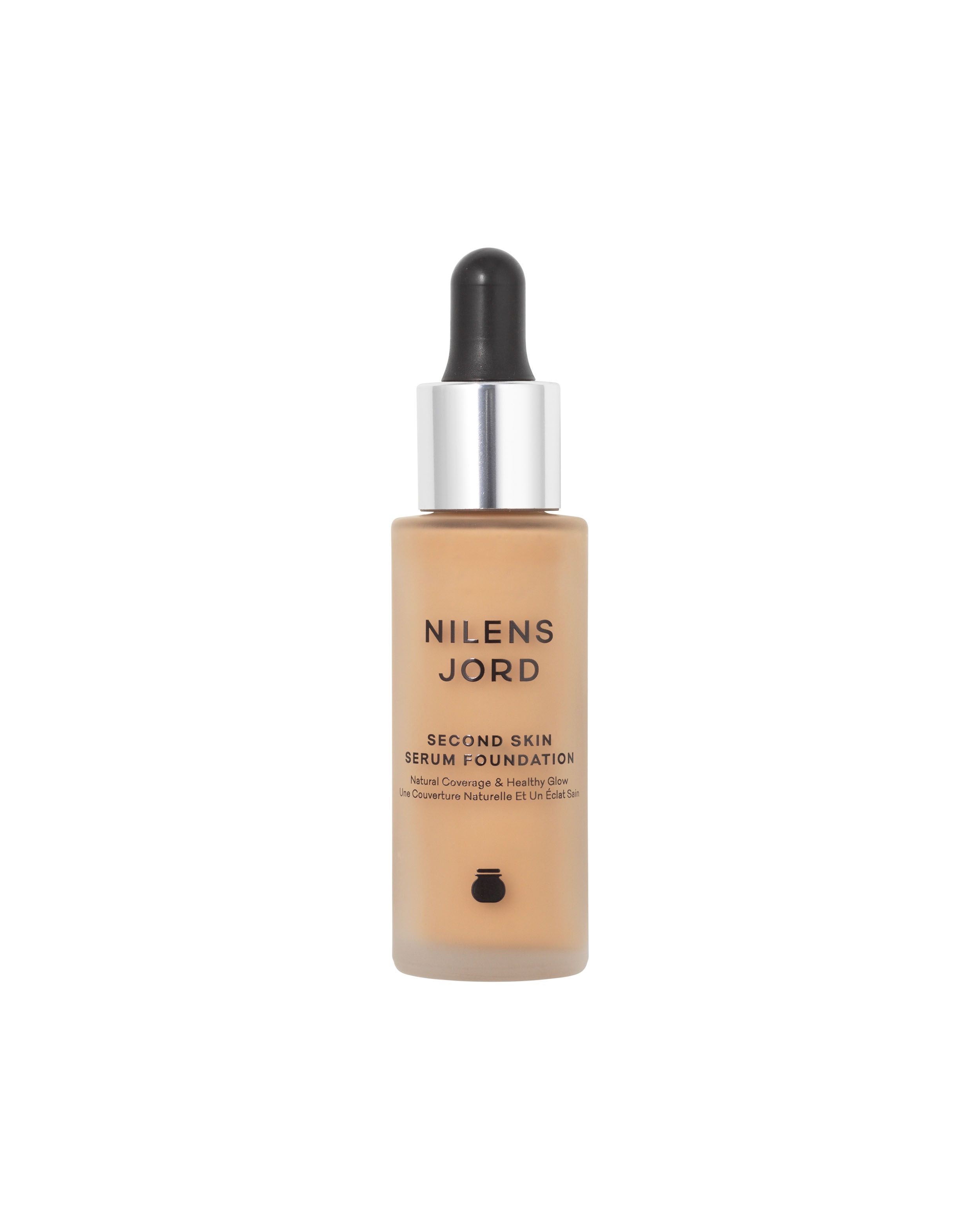 Nilens Jord Second Skin Serum Foundation in einem Glasfläschchen mit Pipette. Natürliche Deckkraft und gesunder Glanz.