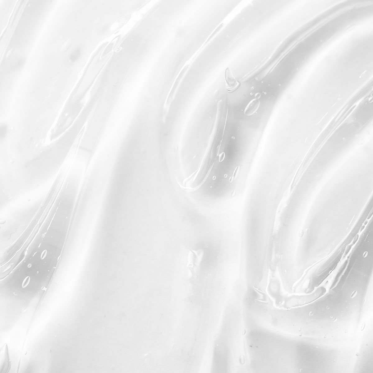 Eine glatte, transparente Geltextur mit sanften Wellen und kleinen Luftblasen.