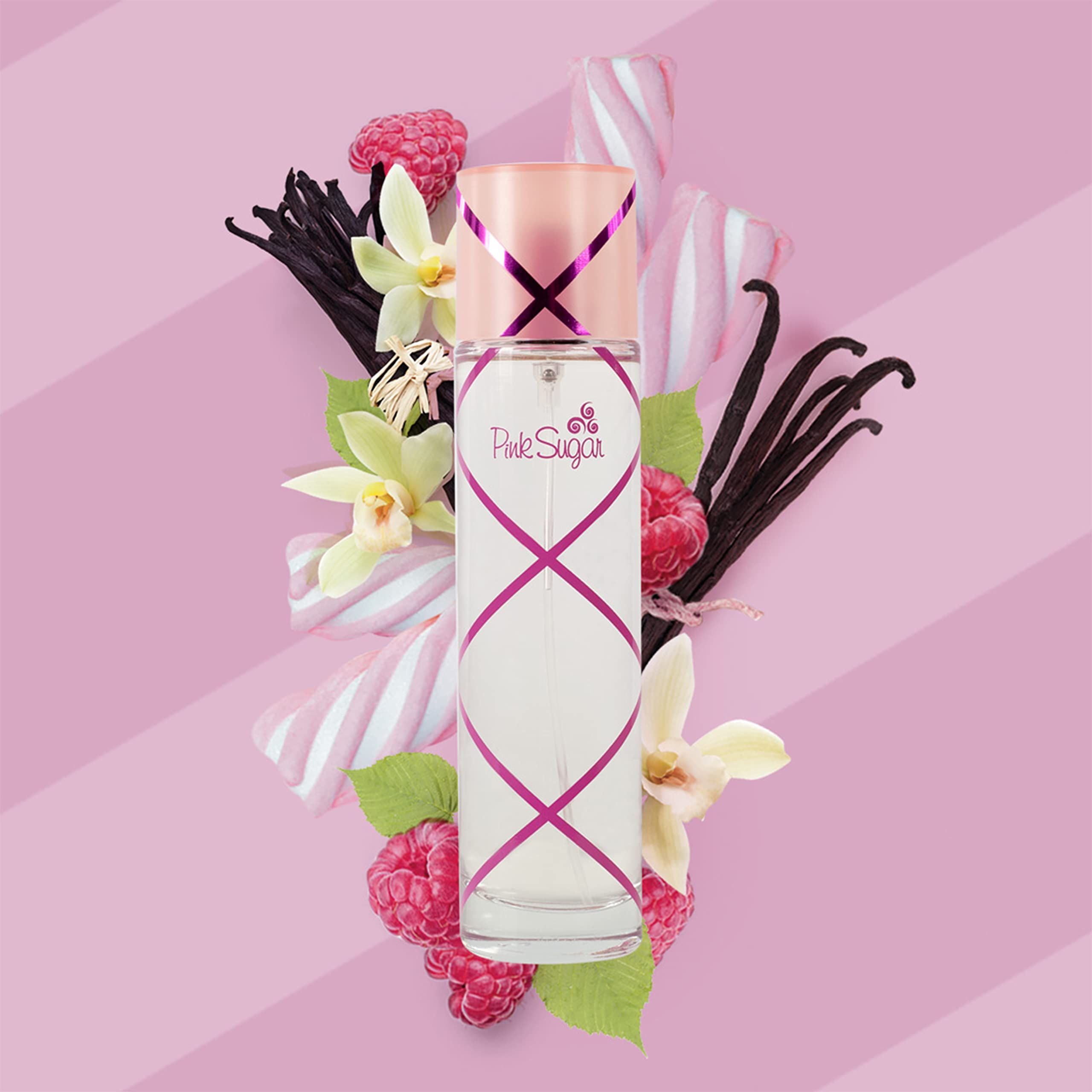 Parfümflasche mit Früchten und Süßigkeiten. Rosa Hintergrund. Flasche mit rosa Akzenten und Schriftzug.