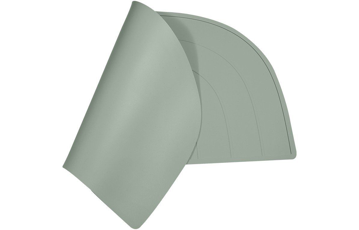 Pistazienfarbenes Platzdeckchen, teilweise aufgerollt, Regenbogenform erkennbar.