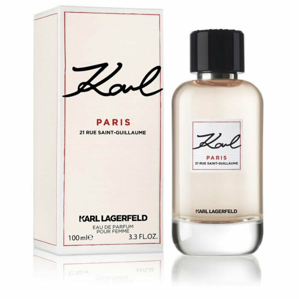 Parfümflasche und Verpackung. Aufschrift: Karl Paris, 21 Rue Saint-Guillaume. Schwarzer Deckel, weiße Flasche.