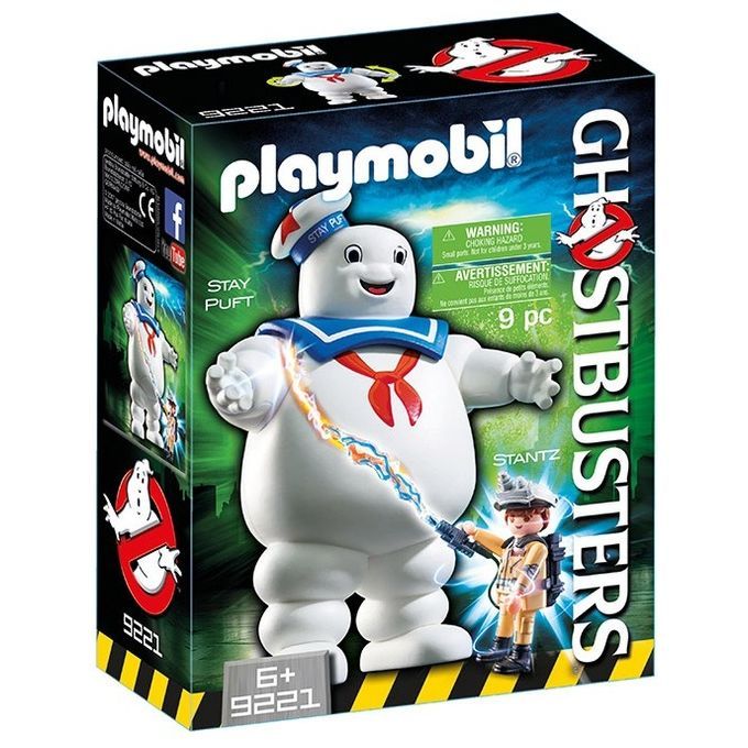 Set Playmobil con l'uomo Marshmallow e E. Stantz di Ghostbusters. La confezione mostra l'uomo Marshmallow, Stantz e il logo Ghostbusters. Il set contiene 9 pezzi ed è adatto a bambini dai 6 anni in su. Il marchio Playmobil è ben visibile.