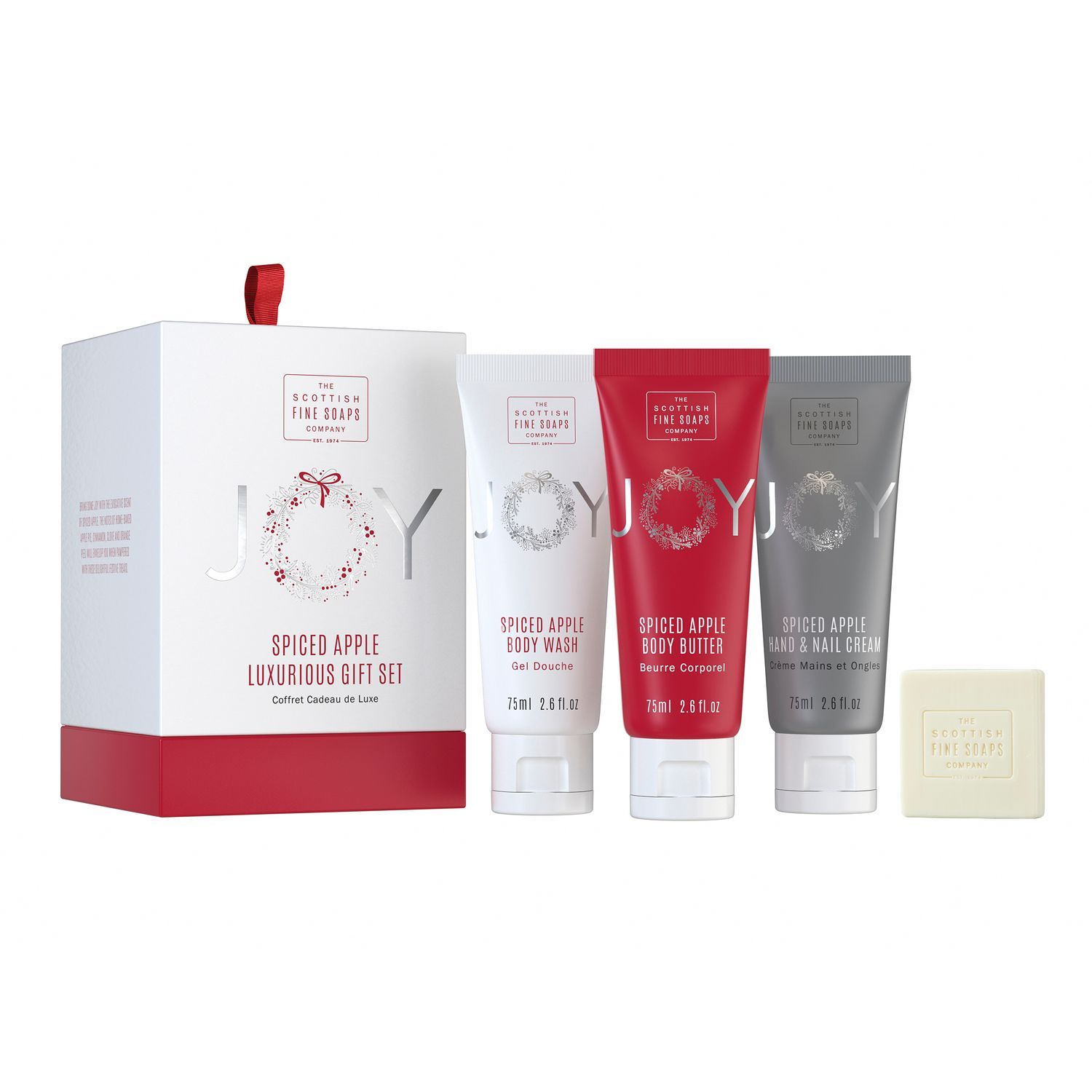 Geschenkset mit weißer Schachtel und roten Akzenten. Enthält Tuben und Seife. Aufschrift: Joy, Spiced Apple, The Scottish Fine Soaps.