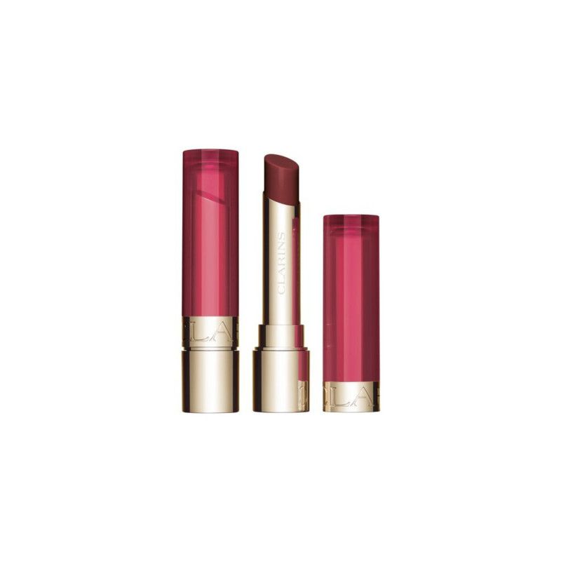 Lippenbalsam mit geöffneter Kappe und Stift. Goldfarbener Boden, transparenter Deckel. Aufschrift.