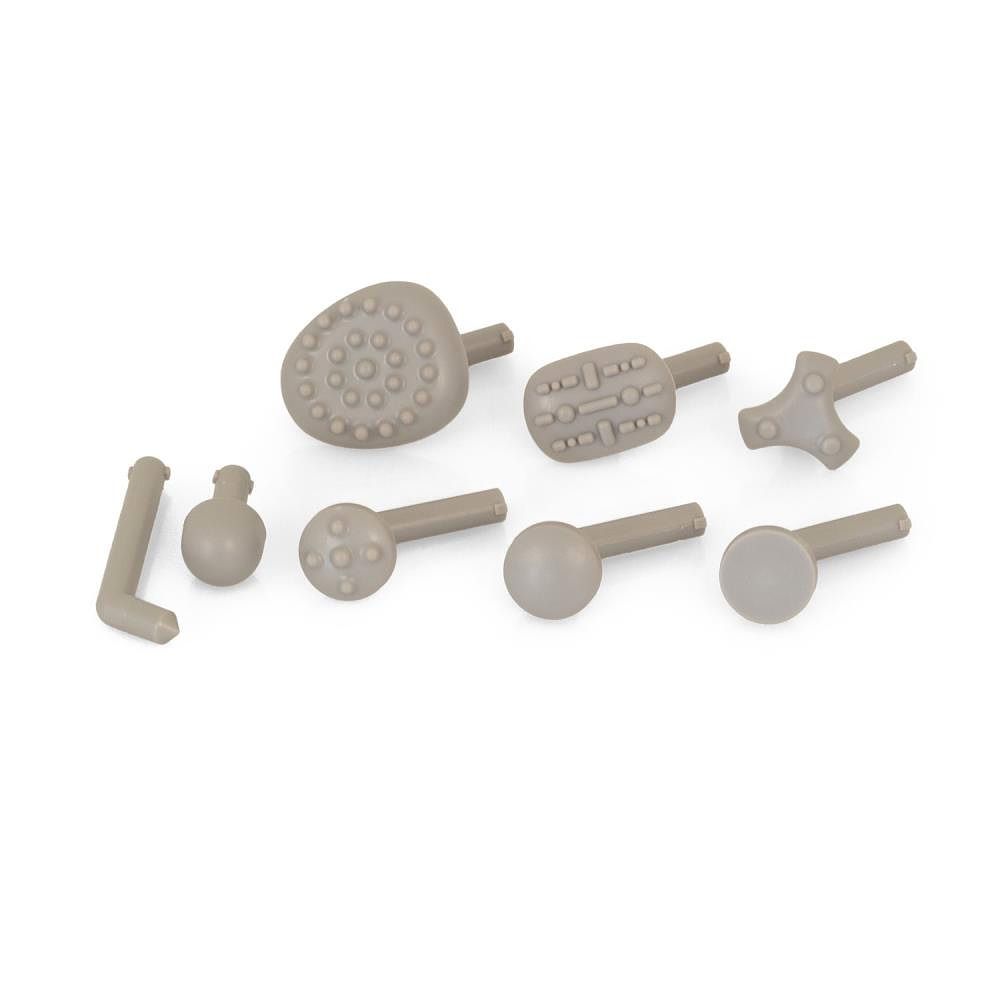 Sieben graue Massageaufsätze in verschiedenen Formen. Auf weißem Hintergrund.