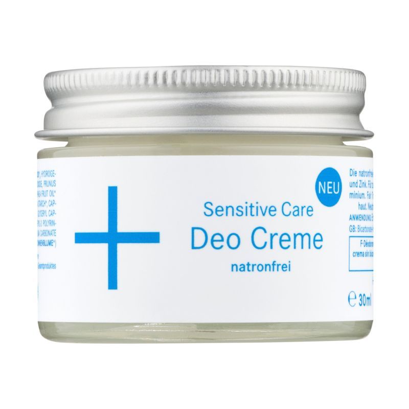 Deocreme in einem Glas mit silbernem Deckel. Aufschrift: Sensitive Care Deo Creme, natronfrei. Blaues Kreuz-Symbol.