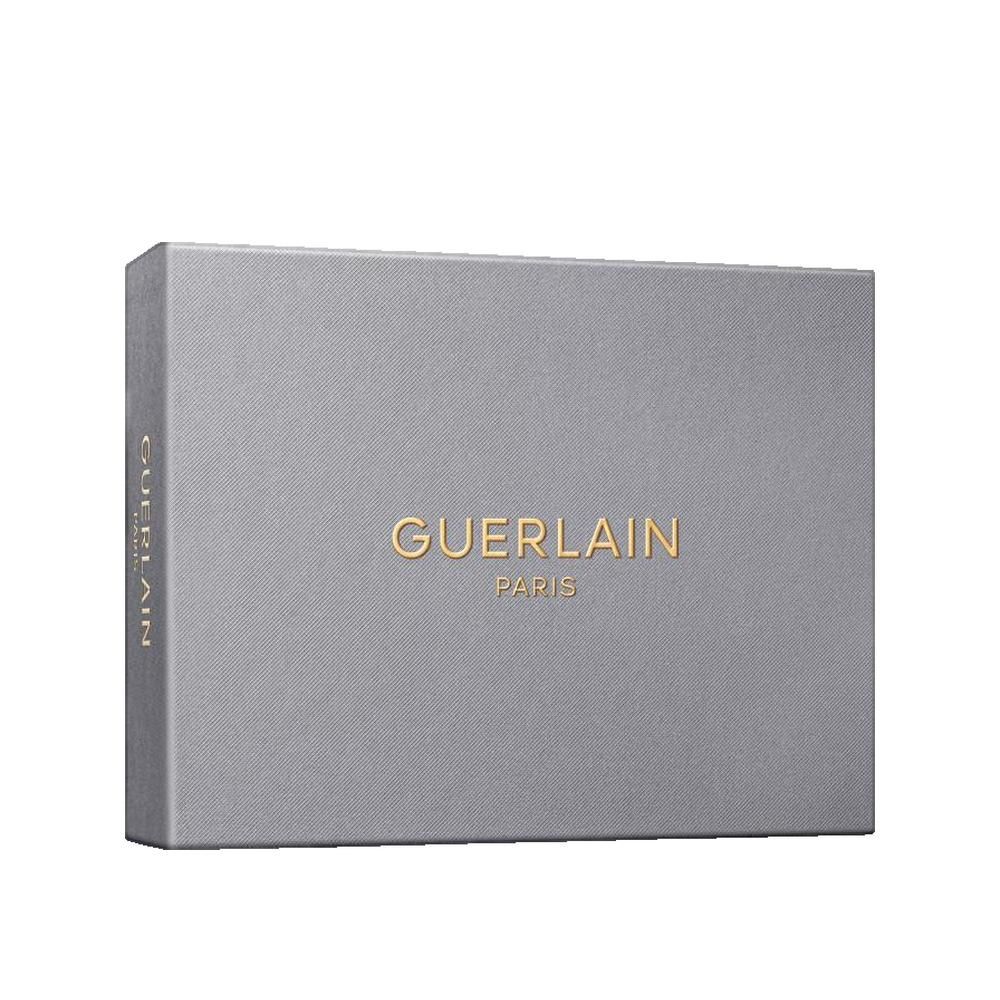 Graue rechteckige Geschenkbox. Goldener Schriftzug Guerlain Paris. Auf der Seite steht Guerlain.