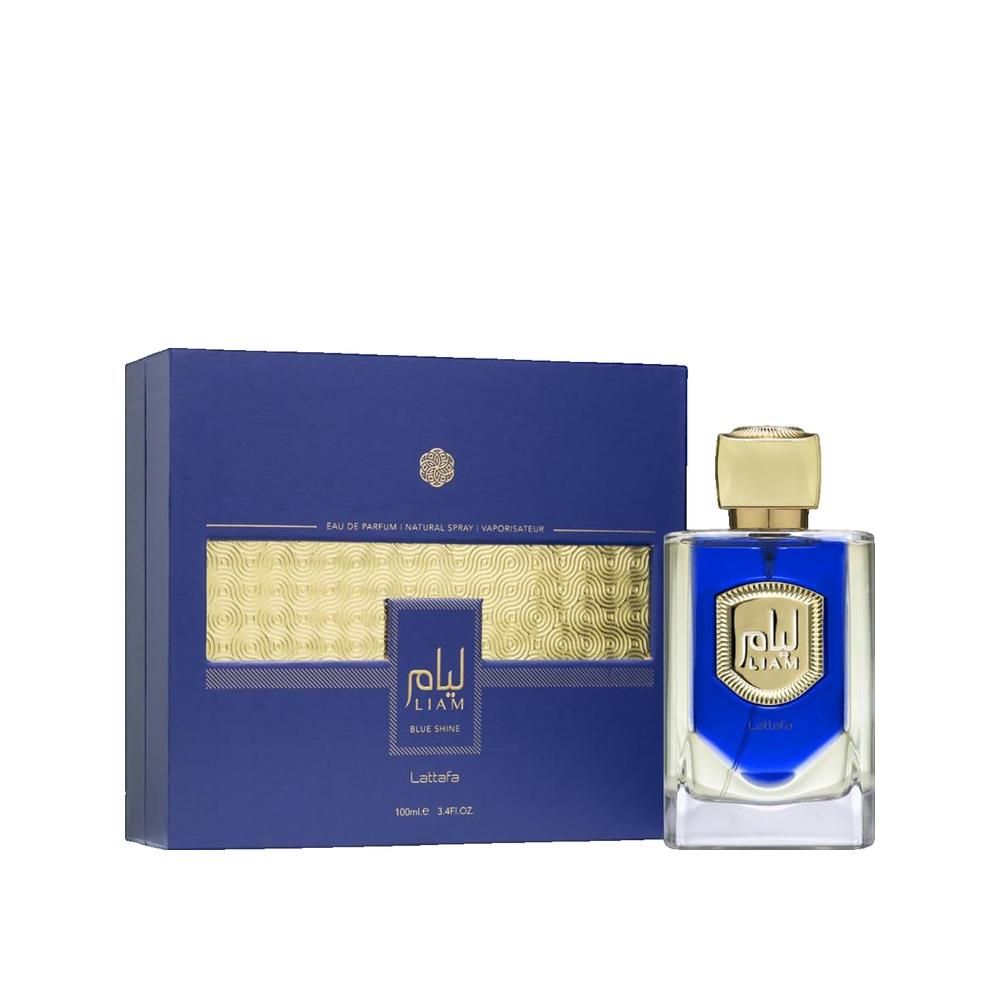 Blaues Parfümflakon und Schachtel. Goldfarbener Deckel, blaue Flüssigkeit. Aufschrift: Liam, Lattafa. Rechteckige Schachtel mit Goldmuster.