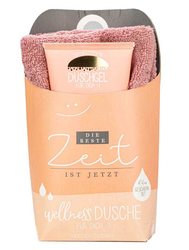 Set regalo con gel doccia e asciugamano. Confezione con scritta "Wellness Dusche".
