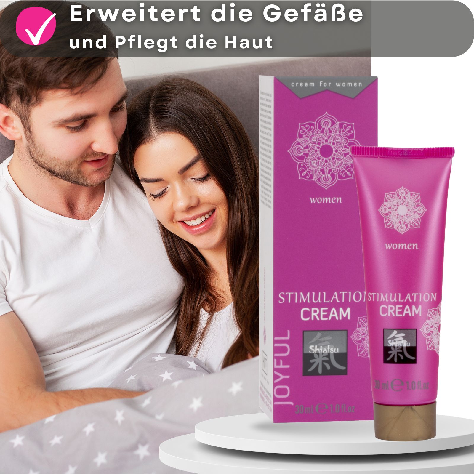 Schachtel und Tube. Aufschrift: Stimulation Cream, Shiatsu, Joyful. Für Frauen. Paar im Hintergrund.
