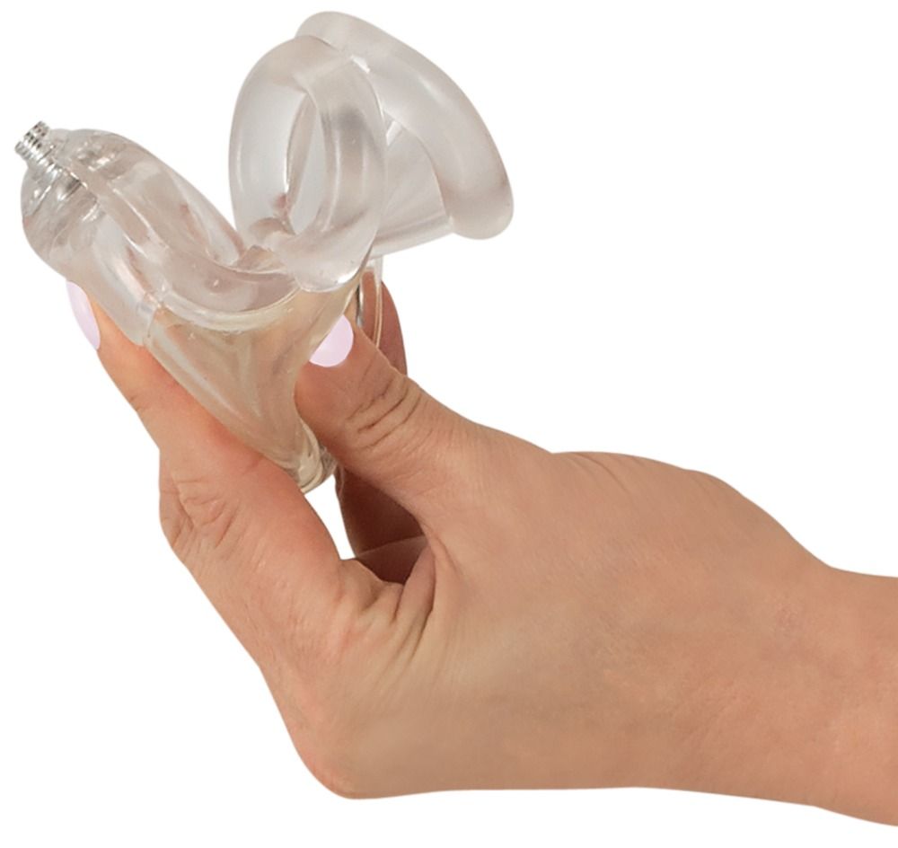 Transparentes, flexibles Produkt mit gebogener Form und Hodenring, gehalten von einer Hand.
