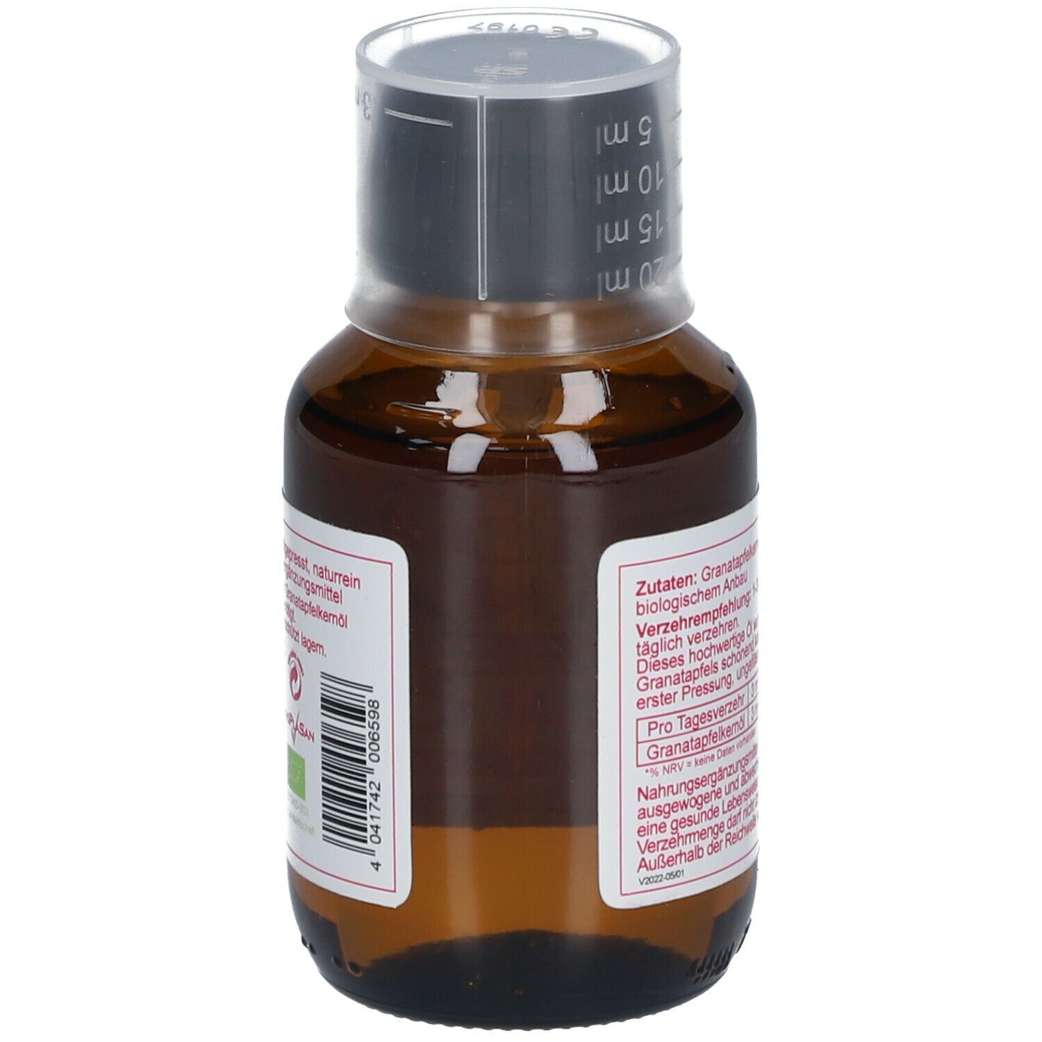 Braune Glasflasche mit Messbecherverschluss. Etikett mit Inhaltsangaben und Bio-Siegel. BIO Granatapfel Kernöl.