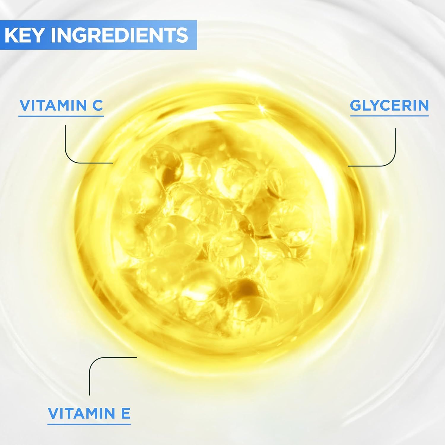 Nahaufnahme von gelben Flüssigkeiten mit den Texten Vitamin C, Glycerin und Vitamin E. Auf blauem Hintergrund.