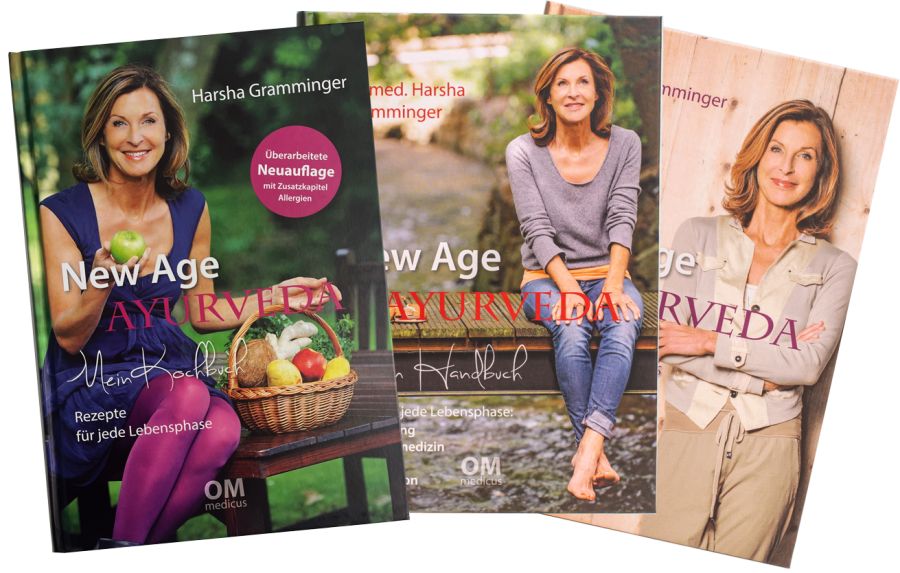 Drei Bücher: New Age Ayurveda - Meine Trilogie. Cover mit Frau, Äpfeln, Korb. Titel und Autor sichtbar.