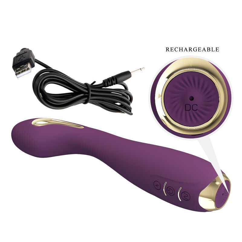 Lila Vibrator mit goldfarbenen Akzenten. Enthält ein Ladekabel. Beschriftung: Rechargeable, DC.