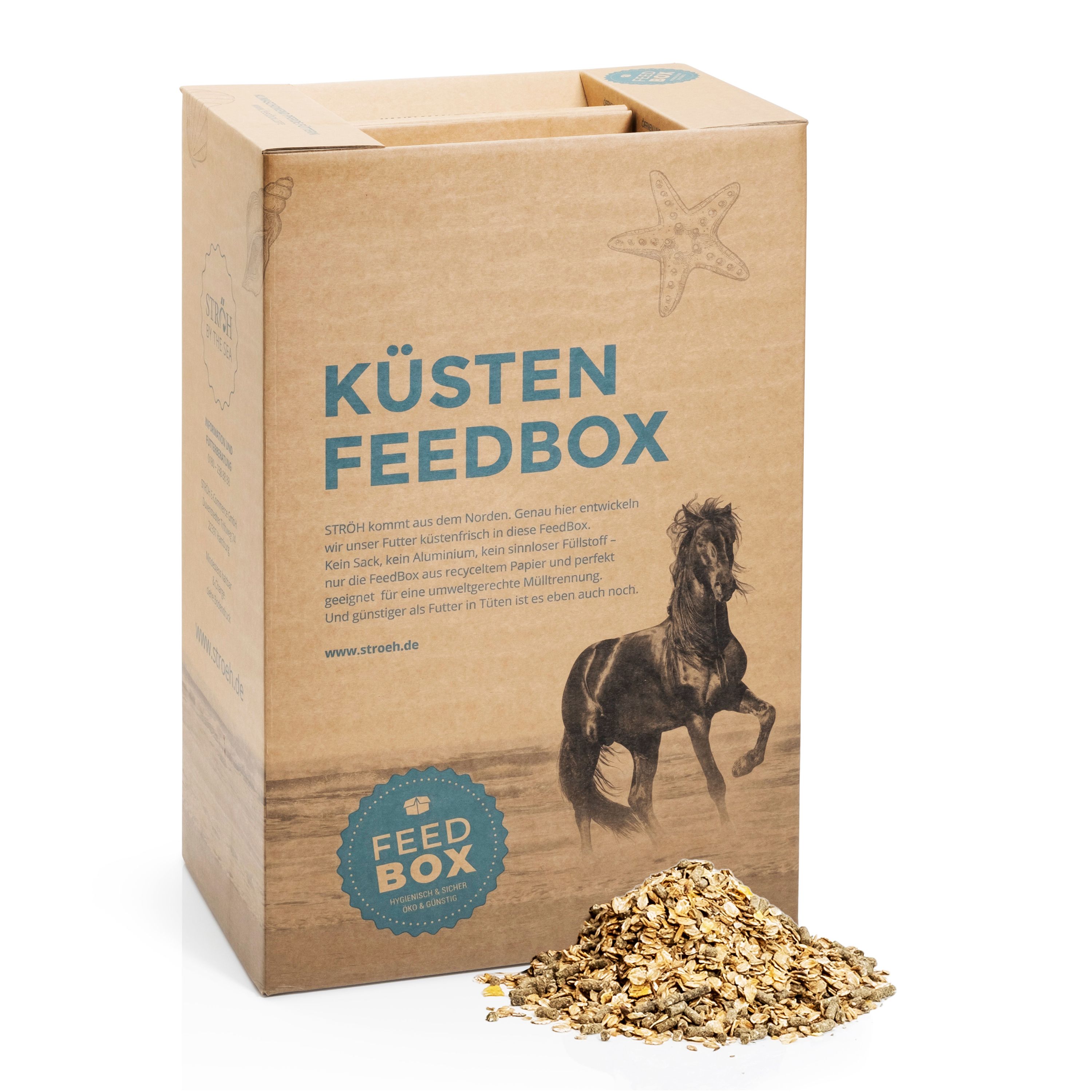 Karton mit Aufdruck "KÜSTEN FEEDBOX" und Logo. Braune Verpackung mit Müsli-Haufen. Text: "STRÖH Küsten Vitalia Müsli Feedbox".