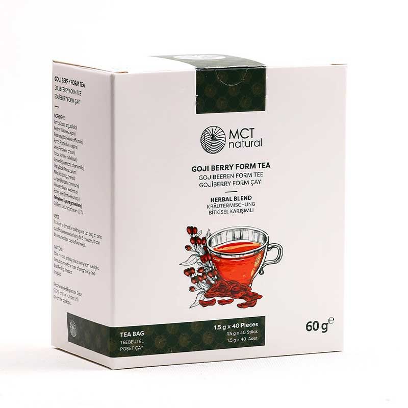 Weißer Karton mit MCT natural® Gojibeeren Formtee. Aufdruck: Produktname, Logo, Illustration einer Tasse Tee mit Gojibeeren. 60g.