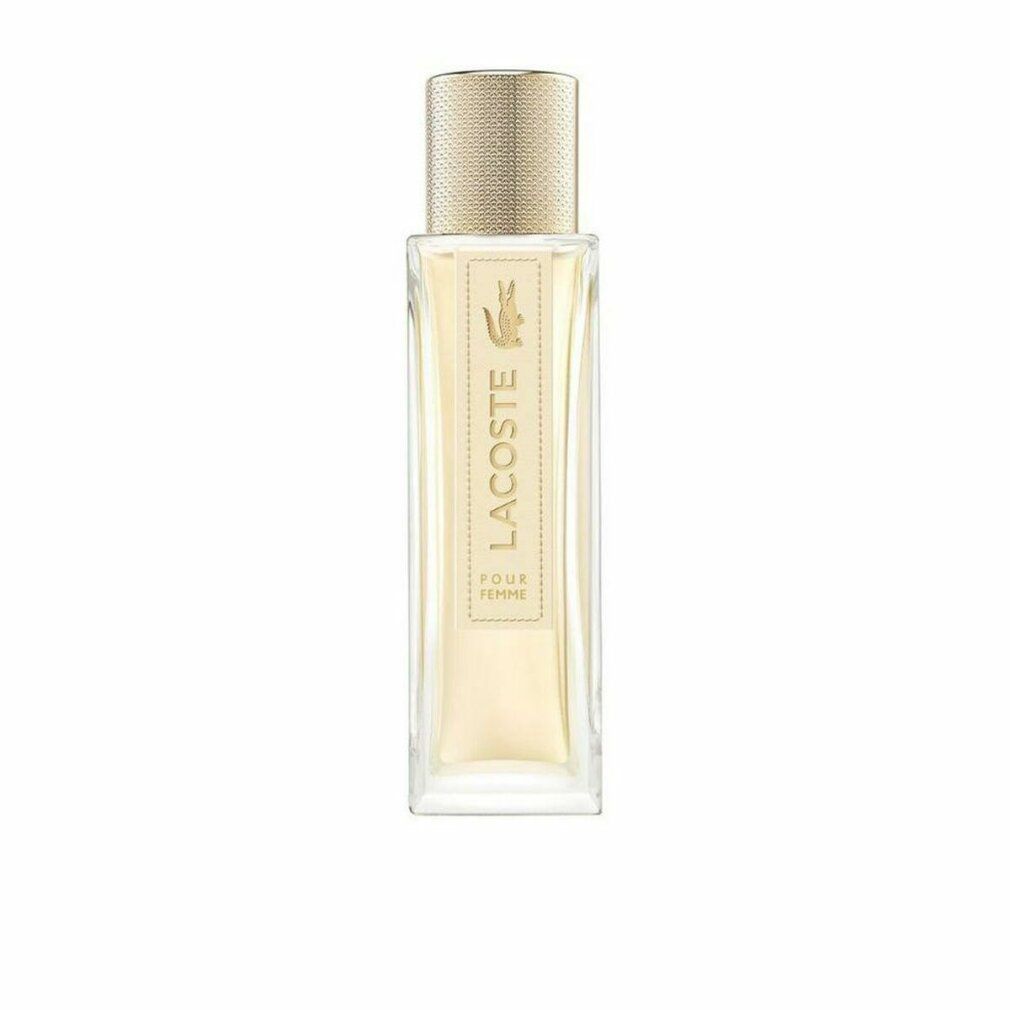 Lacoste Pour Femme Eau de Parfum Flakon mit goldenem Verschluss und Krokodil-Logo.