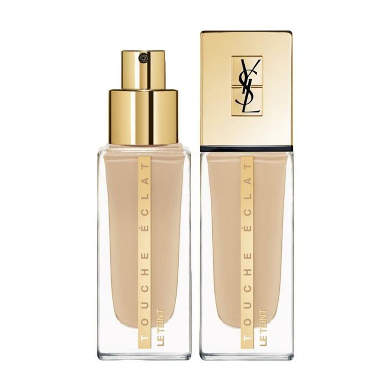 Zwei Flakons Yves Saint Laurent Touche Éclat Le Teint. Quadratische, transparente Flakons mit goldenen Deckeln und Aufschriften.