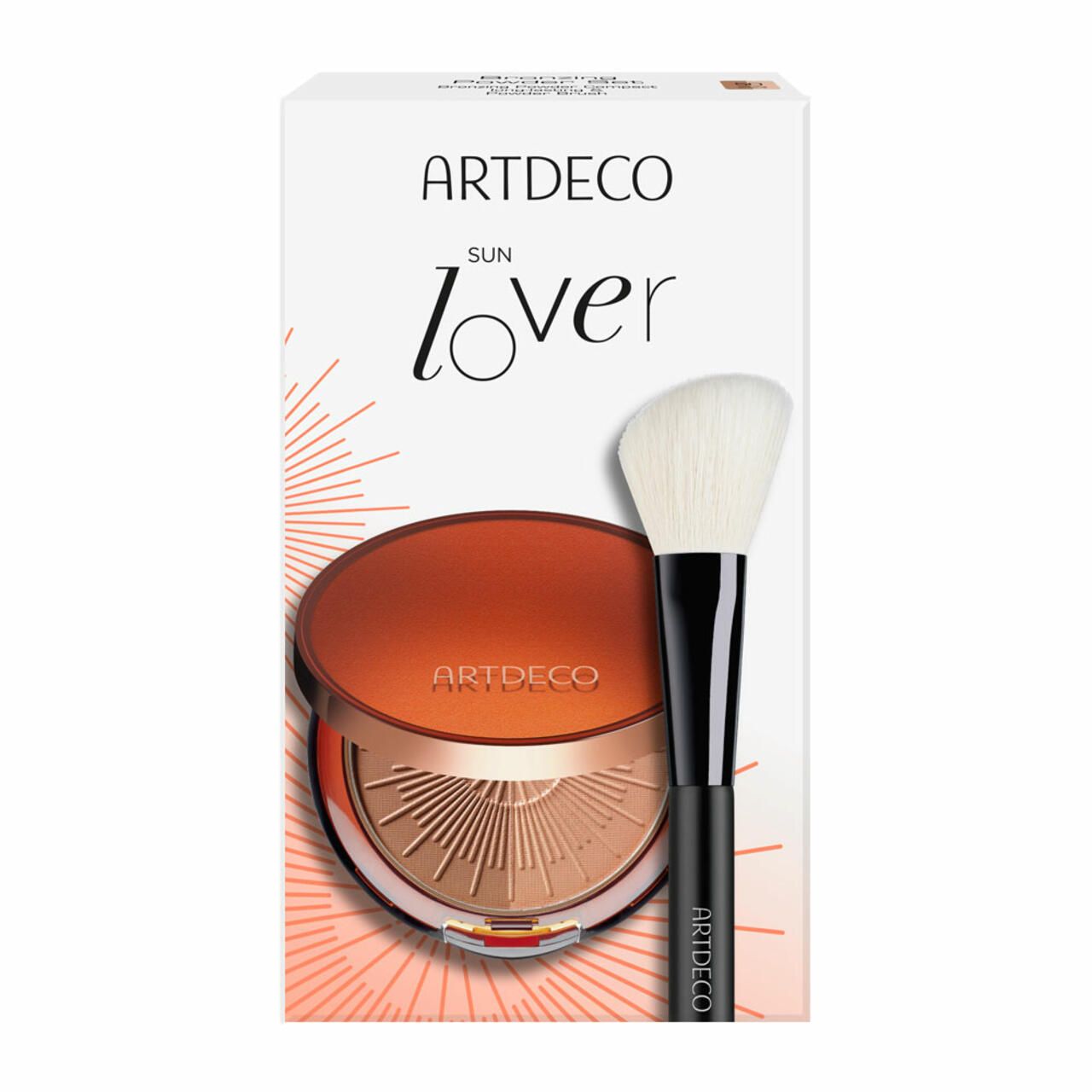 Bronzing Powder Set. Kompakte Bronzepuder mit Pinsel. Verpackung mit Markenlogo und Produktnamen. Pinsel mit schwarzem Griff und hellem Pinselkopf.
