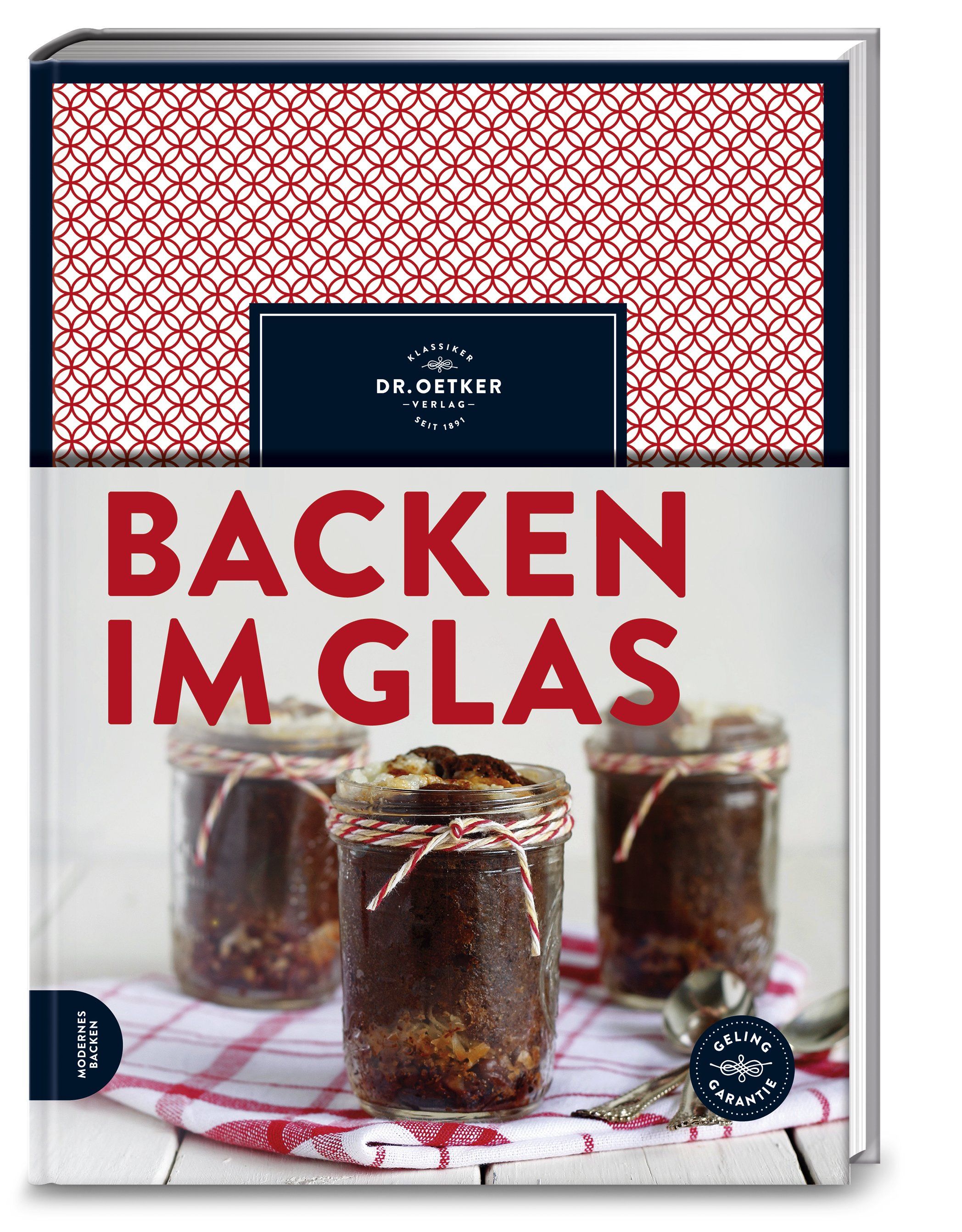 Buch "Backen im Glas". Titel in Rot. Oben rotes Muster. Logo Dr. Oetker. Drei Gläser mit Kuchen auf kariertem Tuch.