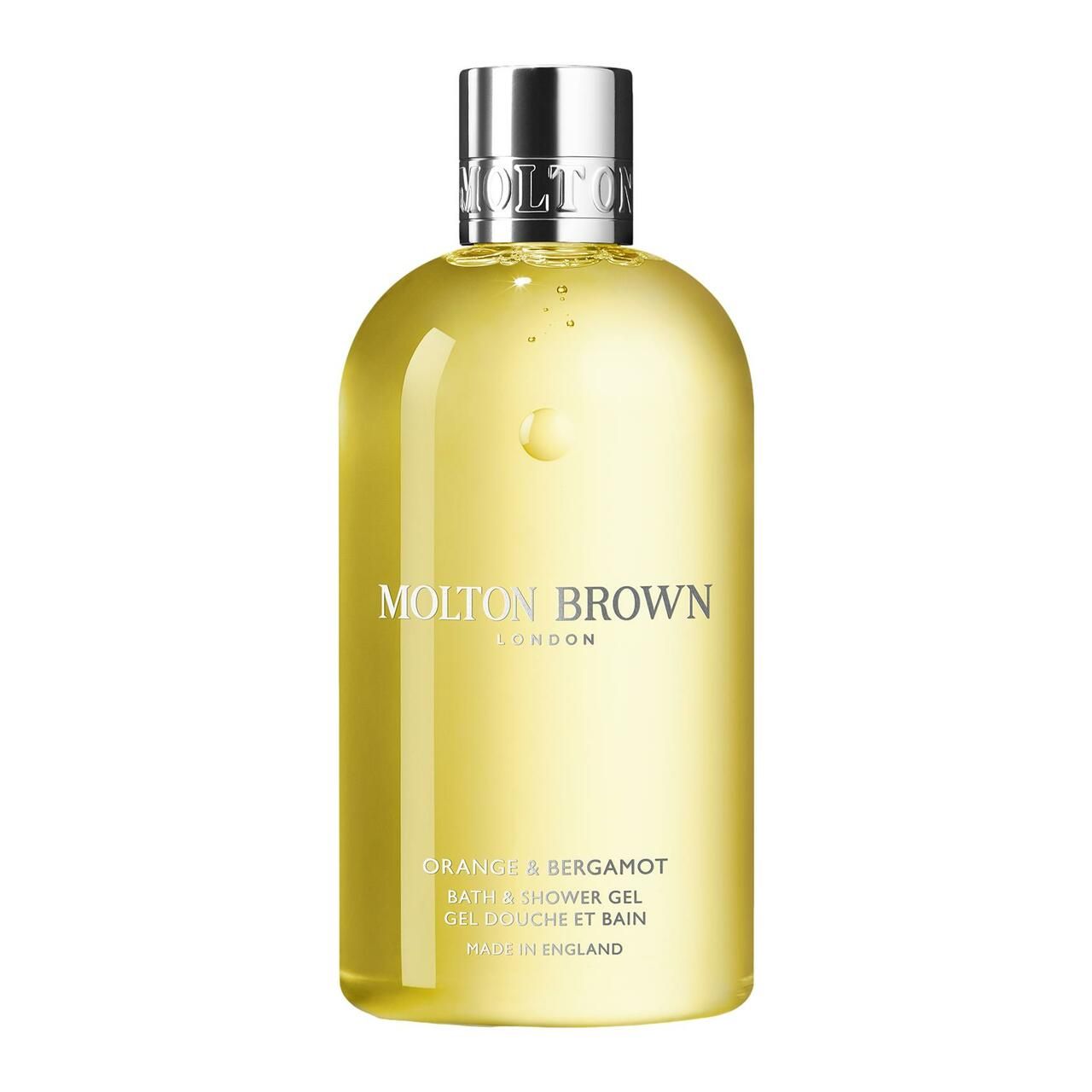 Gelbe Flasche mit silbernem Deckel. Aufschrift: Molton Brown, Orange & Bergamot, Bath & Shower Gel. Hergestellt in England.