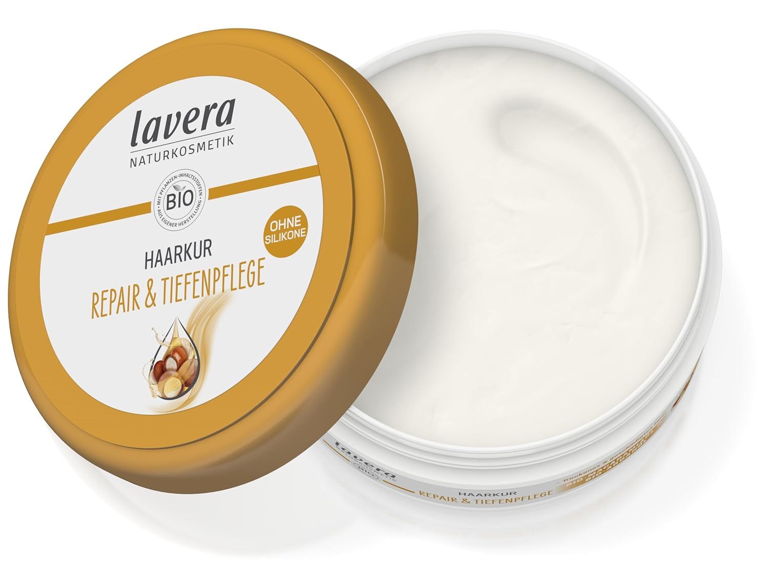 Geöffnete Dose Haarkur. Goldfarbener Deckel mit weißem Etikett. Produktname und Logo sichtbar. Creme-Textur im Inneren.