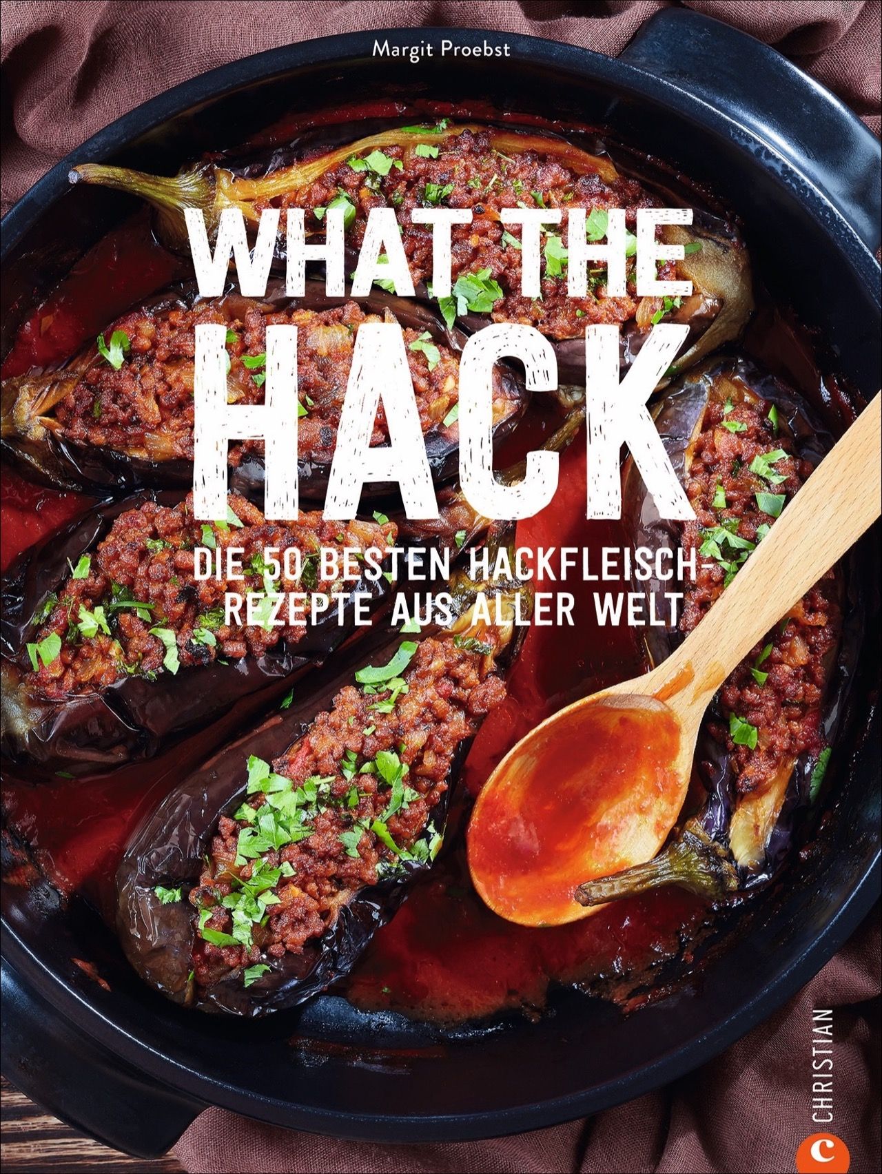 Buchcover mit dem Titel "What the Hack!" und dem Untertitel "Die 50 besten Hackfleisch Rezepte aus aller Welt". Gezeigt werden gefüllte Auberginen.
