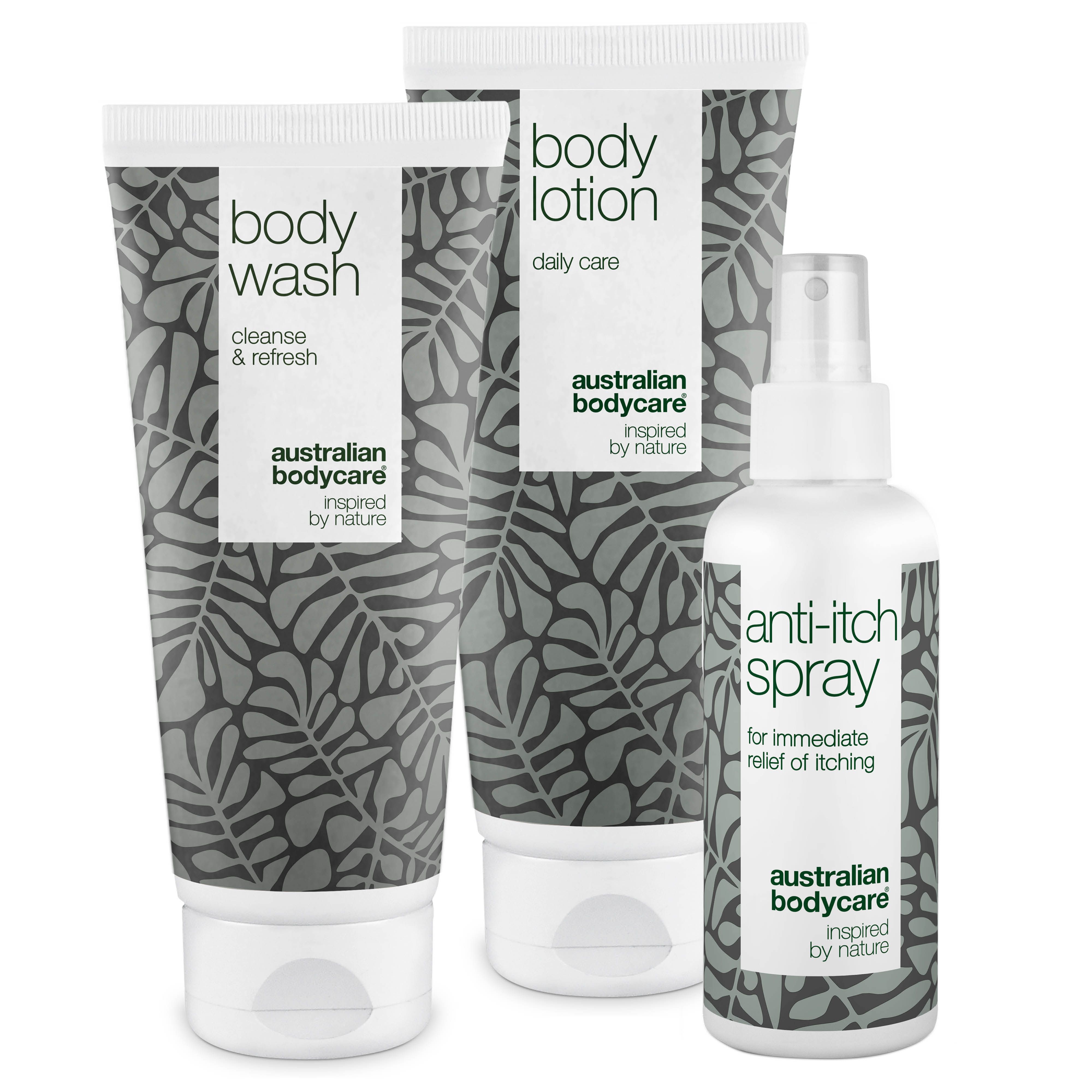 Drei Produkte: Body Wash, Body Lotion und Anti-Juckreiz-Spray. Graue und weiße Verpackung mit Blättermuster.