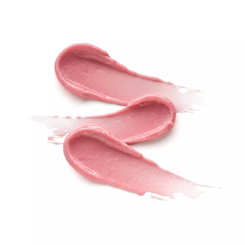Drei rosa Lippenbalsam-Swatches auf weißem Hintergrund. Die Textur ist cremig und glänzend. Die Swatches sind in einer geschwungenen Form angeordnet.