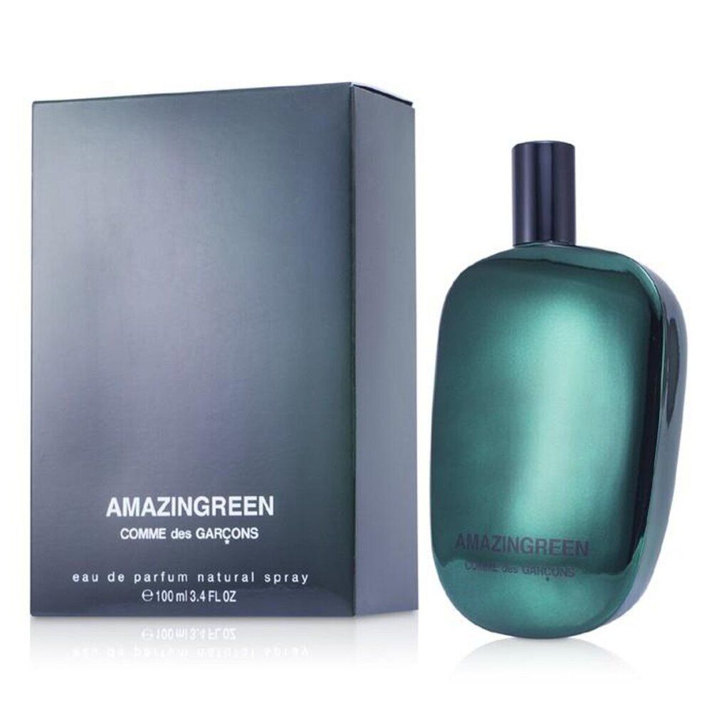 Grüne Flasche und Schachtel. Aufschrift: AMAZINGREEN, COMME des GARÇONS. Flasche mit schwarzem Verschluss.