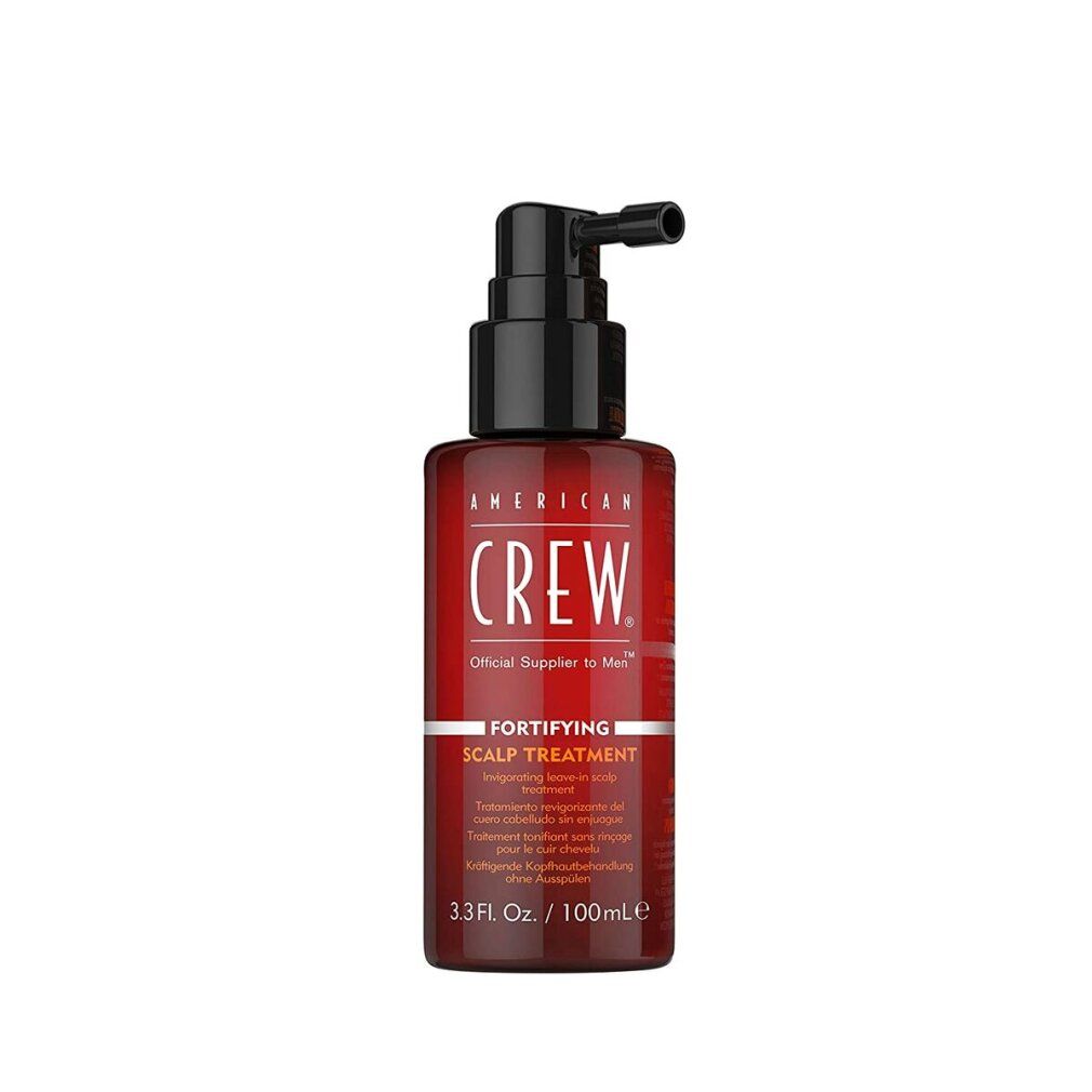 Braune Flasche mit schwarzem Pumpkopf. Aufschrift: AMERICAN CREW. Produktbezeichnung und Volumenangabe.