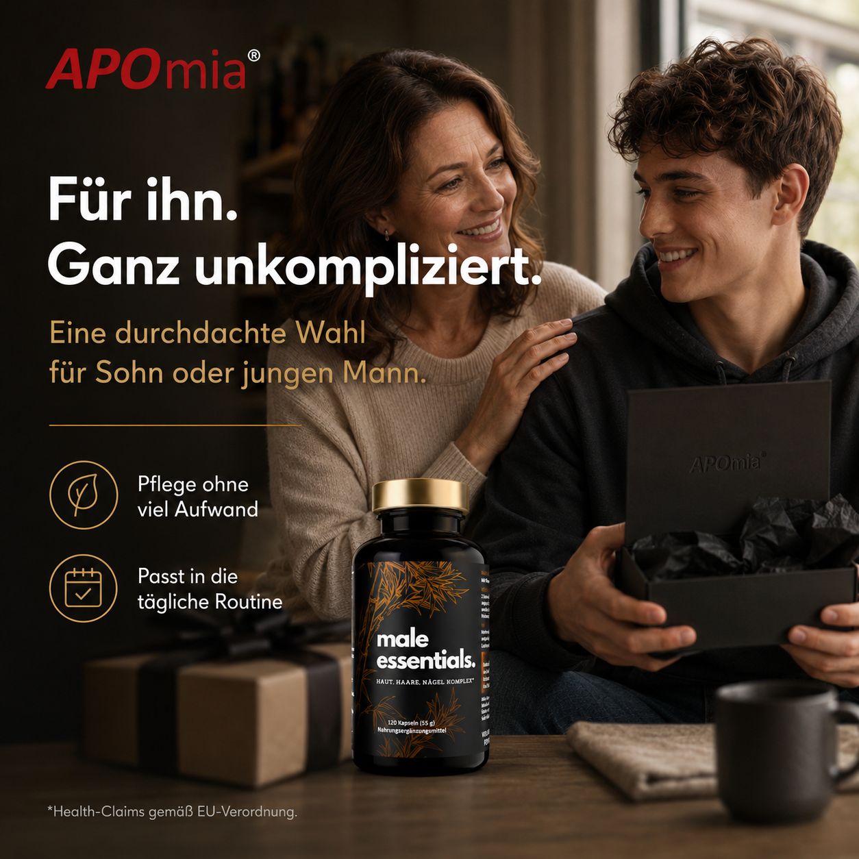 Frau und junger Mann mit Geschenkbox und Flasche Male Essentials.