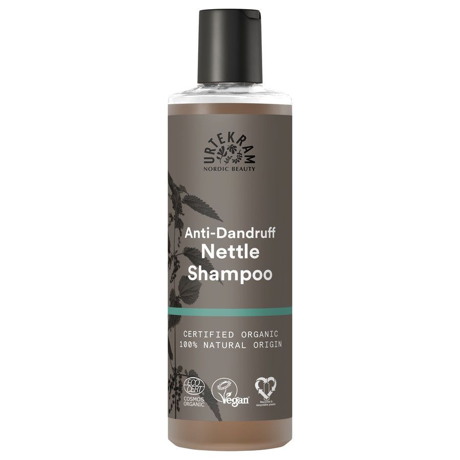 Braune Flasche mit schwarzem Deckel. Aufschrift: Anti-Schuppen Nessel Shampoo. Zertifiziertes Bio-Produkt.