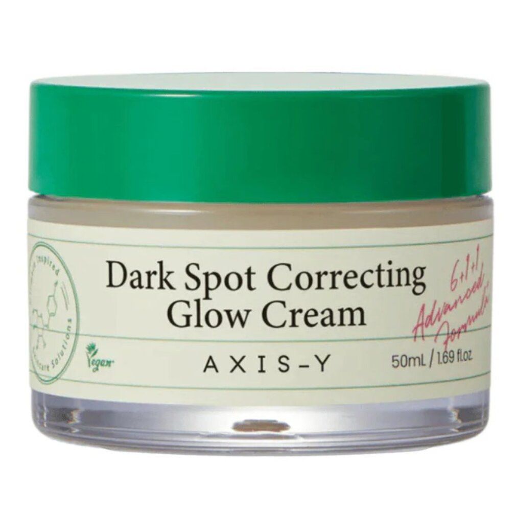 AXIS-Y Dark Spot Correcting Glow Cream in einem Glasbehälter mit grünem Deckel.