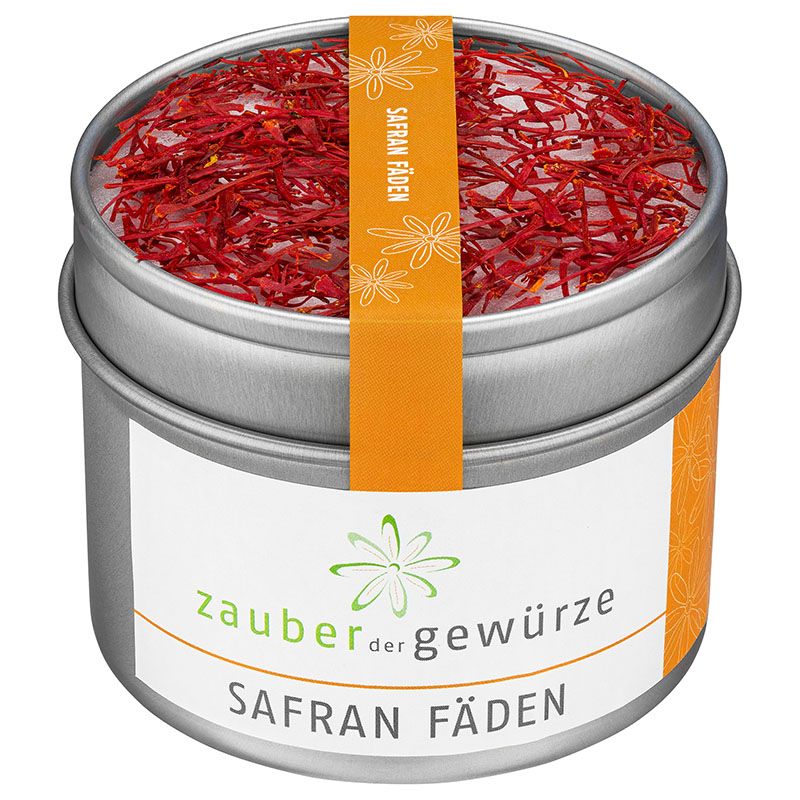 Runde Dose mit Safran-Fäden. Orangefarbenes Etikett mit Schriftzug "SAFRAN FÄDEN". Weißes Etikett mit "zauber der gewürze".