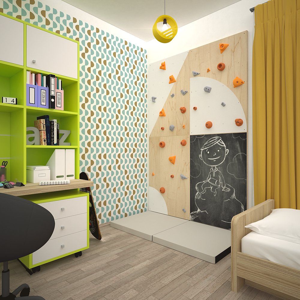 Kletterwand mit bunten Griffen und Tafel. In einem Kinderzimmer mit Schreibtisch und Bett.