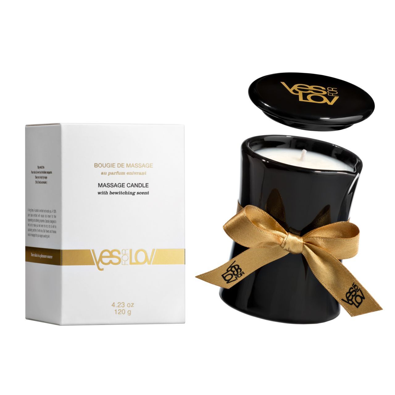 Schwarze Massagekerze mit goldenem Band und Deckel. Weiße Verpackung mit Logo und Text.