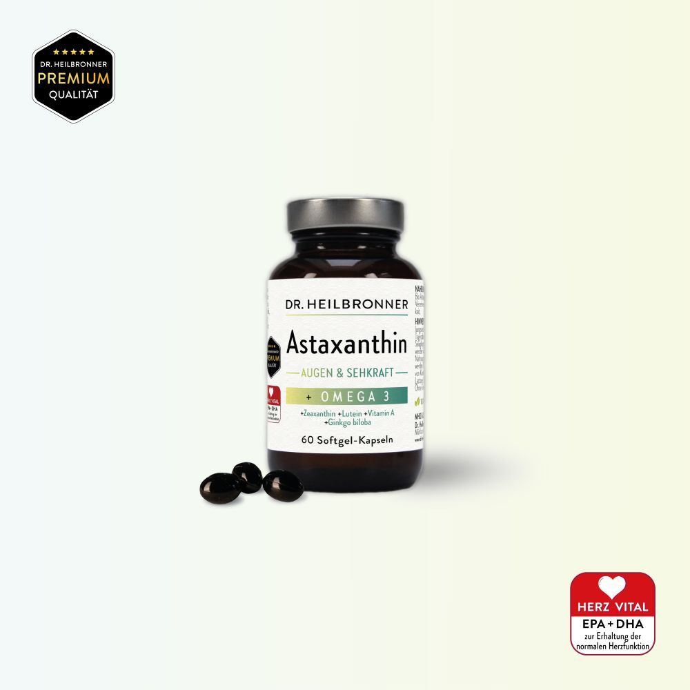 Braune Flasche mit Astaxanthin-Kapseln. Aufschrift: Astaxanthin AUGEN & SEHKRAFT + Omega 3. 60 Softgel-Kapseln. Einige Kapseln daneben.