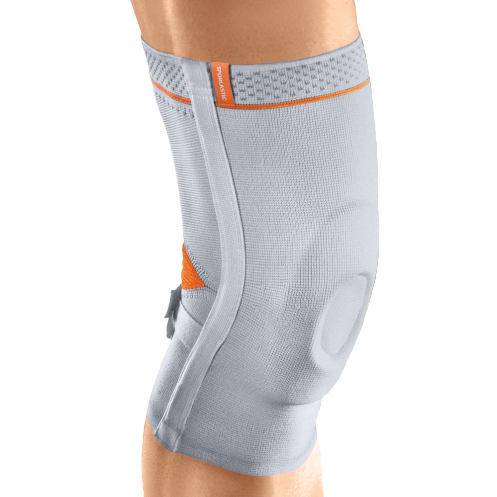 Kniebandage Sporlastic Super-Genuplus, grau. Mit orangefarbenen Akzenten. Seitliche Verstärkung und Öffnung für die Kniescheibe.
