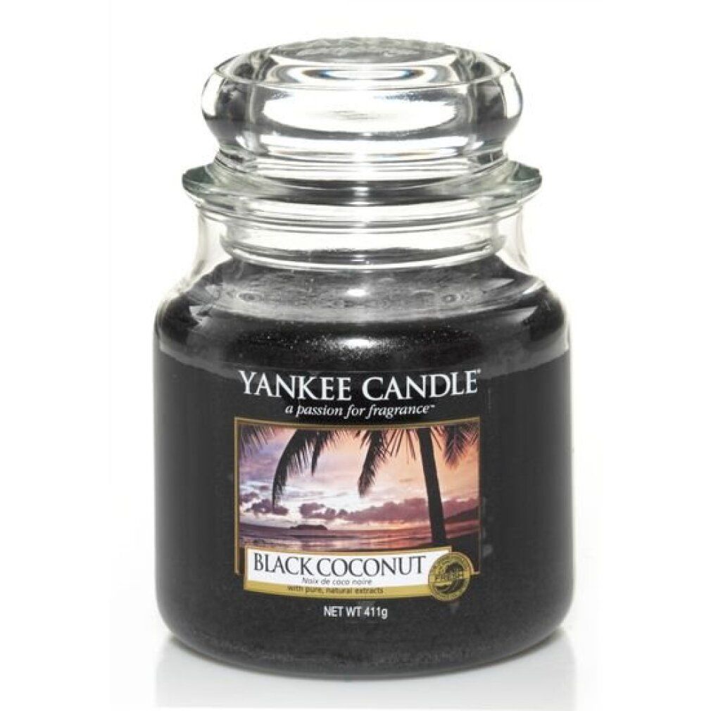 Yankee Candle Black Coconut Duftkerze im Glas mit Deckel. Schwarzes Wachs. Etikett mit Palmenmotiv.