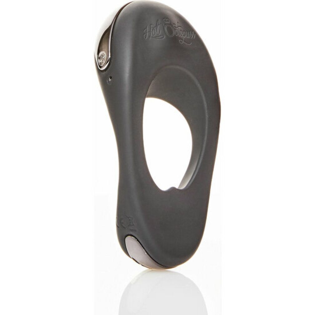 Dunkelgrauer Cockring mit ovaler Öffnung. Oberseite mit silberfarbenem Akzent und Logo. Unterseite mit silberfarbenem Element.