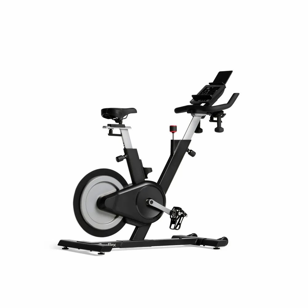 Vélo d'intérieur. Cadre noir, volant d'inertie gris. Affichage numérique. Guidon et siège réglables. Pédales à sangles.