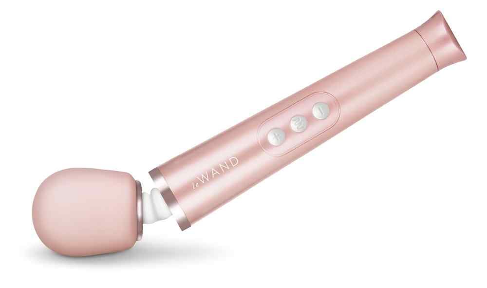 Rosegoldfarbenes Wellness-Produkt. Drei Knöpfe, Aufschrift "le Wand".