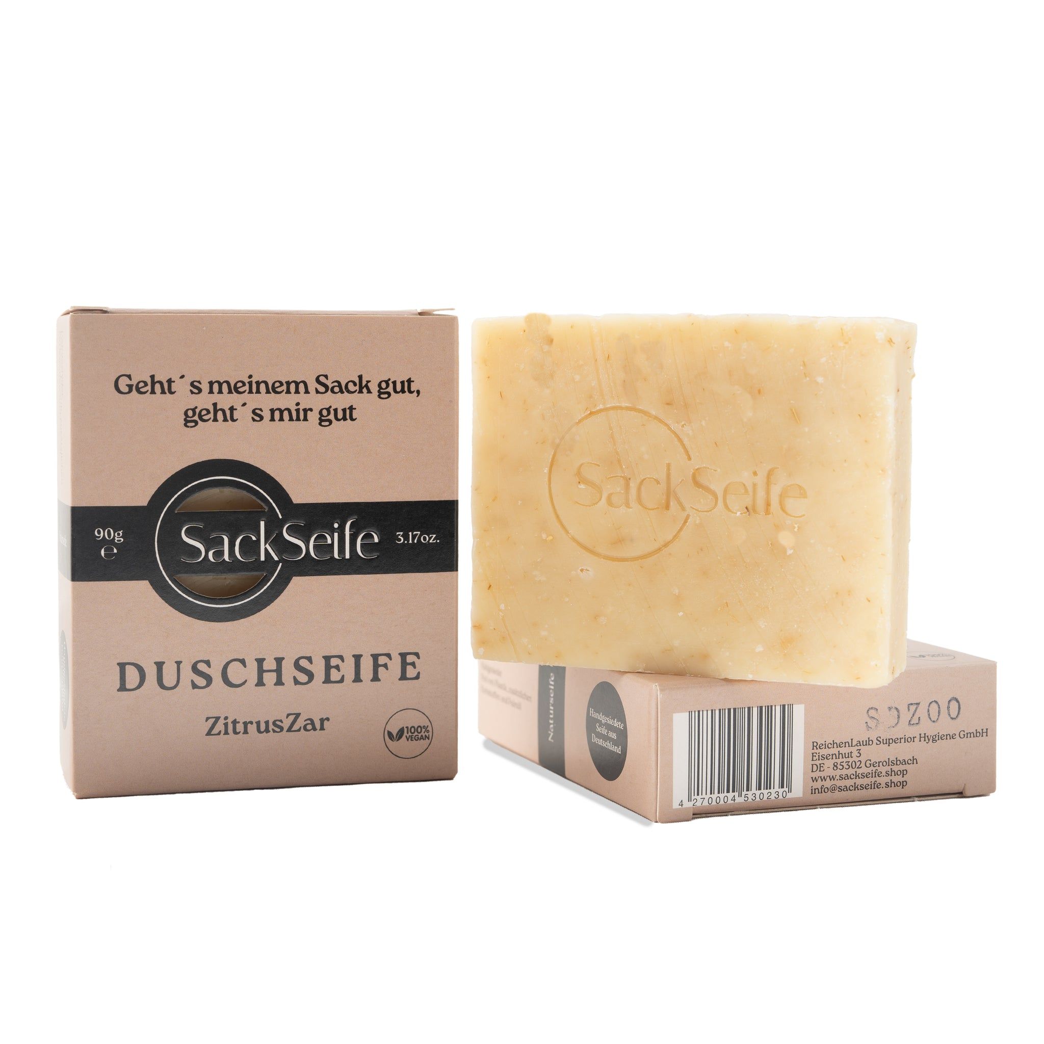 ZitrusZar Duschseife und Verpackung. Eckige Seife mit SackSeife Logo. Karton mit Text und Logo. Vegan-Siegel.
