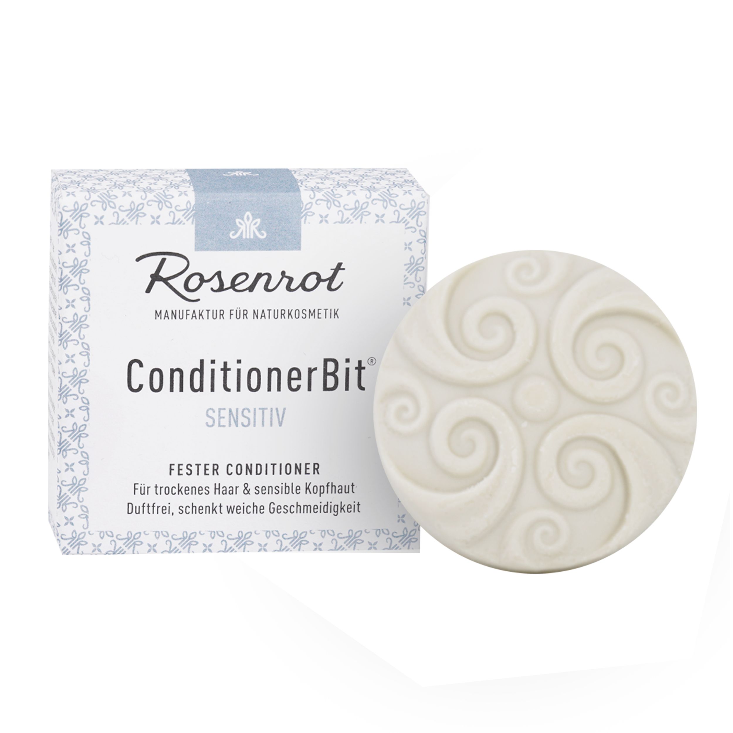 Runder, fester Conditioner mit spiralförmigem Muster. Daneben eine Schachtel mit Produktinformationen.